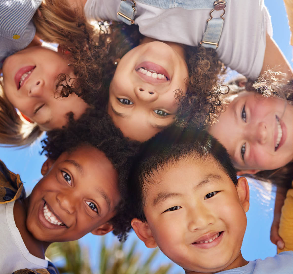 Friends, smile and below portrait of children outdoors for summer holiday, weekend and playing games together. Childhood, friendship and group of kids in circle for diversity, community and support.